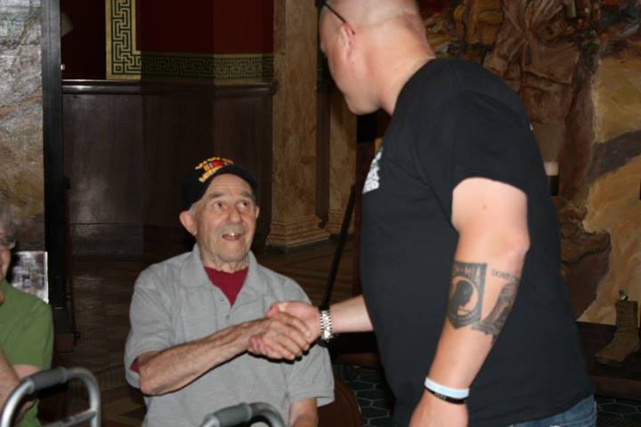 My dad, Dan Antonietti, and Marine Mike Strahle share a tender moment at the Lima Company Memorial exhibit.